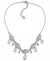 The perfect accessory for your big day. Carolee's lovely bridal necklace stuns with glass pearl drops and sparkling glass and plastic accents. Set in silver tone mixed metal. Approximate length: 16 inches + 2-inch extender. Approximate drops: 5/8 inch.