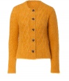 Casual daytime looks get a shock of radiant color with By Malene Birgers honey-hued cable knit cardigan, detailed in an soft textural angora mix for ultra cozy results - Rounded neckline, long sleeves, ribbed trim, button-down front, horn-effect buttons, side slits, cropped boxy fit - Pair with favorite skinnies, or layer over feminine dresses for work