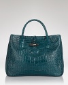 Adopt an exotic approach with this crocodile-effect snakeskin bag from Longchamp. Designed to perfect effortless statement style, it's textured leather and bold hue take every outfit from simple to standout.