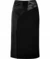 This mixed media pencil skirt from fashion-forward London brand Hakaan features an asymmetric shiny panel and a figure-hugging fit - High waist, shiny asymmetric panel, front slit, pencil silhouette, concealed back zip closure - Pair with an edgy silk blouse and sky-high platforms