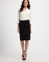 Simply sophisticated stretch wool with a classic, high-waist silhouette. Back zipper About 23 long Wool/lycra; dry clean Made in USA