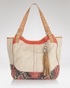 Bag an eclectic accessory with Rafe New York's linen and leather tote. Marrying a roomy silhouette and exotic details, this bag takes flight with oversized frames and flat sandals.