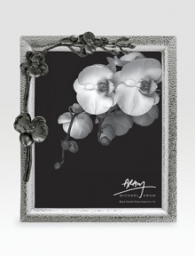 Inspired by the intricacies of natural forms, this graceful frame is richly detailed in cast metal with blackened floral accents. From the Black Orchid CollectionAccommodates a 8 X 10 photoOverall: 10 X 11¾Nickel-plate and blackened nickel-plateImported