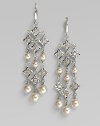 From the Clara Collection. Divine danglers of lustrous pearls and sparkling stars are dramatic for day or night. 6mm and 8mm man-made organic pearls Cubic zirconia Sterling silver Drop, about 2½ Hinge close Made in Spain 