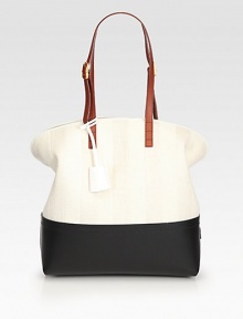 Tonal stripes of straw pairs with rich leather trim in this roomy zip-top bag.Adjustable leather shoulder straps, 8¾-10¼ dropTop zip closureTwo inside open pocketsCenter zip compartmentLinen lining11W X 13H X 5¼DMade in Italy Tonal stripes of straw pairs with rich leather trim in this roomy zip-top bag.Adjustable leather shoulder straps, 8¾-10¼ dropTop zip closureTwo inside open pocketsCenter zip compartmentLinen lining11W X 13H X 5¼DMade in Italy