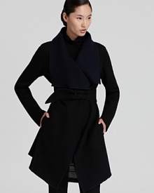 This oversized Donna Karan New York coat is cinched with a fabric belt for a louche fit that's effortlessly flattering for a season of standout looks. Wear the reversible style on its black side workdays and ink side come weekends. This oversized Donna Karan New York coat is cinched with a fabric belt for a louche fit that's effortlessly flattering for a season of standout looks. Wear the reversible style on its black side workdays and ink side come weekends.
