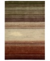 Variegated stripes of earthy tones into warm reds creates a design as artistically moving as it is functional. Hand tufted of long polyester fibers for added strength and softness, the Contour area rug from Nourison creates an ideal accent for any modern room.