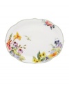 Garden party. The Floral Meadow oval platter brings eternal spring with a mixed bouquet rooted in resilient everyday porcelain. A scalloped edge and green banding add to the charm of the graceful mix-and-match Lenox dinnerware collection. Qualifies for Rebate