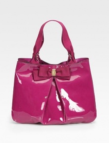 Lustrous patent leather defines this lady-like silhouette, finished withe soft pleating and a demure grosgrain bow.Cotton double top handles, 7 dropMagnetic snap closureCenter zip compartmentOne inside zip pocketTwo inside open pocketsFully lined14W X 10H X 5DMade in Italy Lustrous patent leather defines this lady-like silhouette, finished withe soft pleating and a demure grosgrain bow.Cotton double top handles, 7 dropMagnetic snap closureCenter zip compartmentOne inside zip pocketTwo inside open pocketsFully lined14W X 10H X 5DMade in Italy