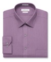 Go beyond basic with a bit of color and this sharp dress shirt from Van Heusen.