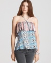 Punch up your look with this dynamic combo print top from Daughters of the Revolution.