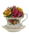 The popular bone china pattern on this tea cup surrounds blooming sprays of colorful English roses with hand-applied bands of 22K gold.