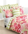 This breezy bedding design from Tommy Hilfiger features clustered hydrangeas in shades of vibrant coral over a watercolor green ground. Broad awning stripes on soft white shams and the duvet cover's reverse present classic, sophisticated style for your modern bedroom.