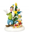 Goofy and Daffy lead three young ducks in cherished Christmas carols. Posing in front of a star-topped tree, these favorite characters add a silly, joyful note to Mickey's Village. From Department 56.