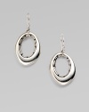 From the Kali Collection. A free-formed, open oval with a pebbled interior in sleek sterling silver. Sterling silverLength, about 1½French wire backImported 