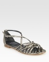 Metallic snake-embossed leather with a strappy front and an adjustable ankle strap. Snake-embossed leather upperLeather liningBuffed leather solePadded insoleImportedOUR FIT MODEL RECOMMENDS ordering one half size down as this style runs large. 