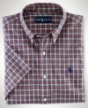 Cut for a relaxed, classic fit, a short-sleeved sport shirt is crafted from crisp cotton poplin in traditional tartan plaid for an authentic look.