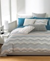 An allover muted floral pattern takes center stage on this Bar III Bedding Moto sham, giving your bed a modern update.