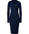 Exquisitely soft and equally flattering, Donna Karans wool jersey dress is an ultra sophisticated choice for a seamless transition from chic days at the office to elegant cocktails in the city - V-neckline, wrapped-effect bodice with pleat detail, long sleeves, gathered waist, pull-over style - Form-fitting, mid-length - Team with sparkly fine jewelry and flawless statement pumps