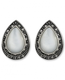 Shimmer and shine. Genevieve & Grace's pretty button stud earrings feature a Mother of Pearl center surrounded by glittering marcasite. Set in sterling silver. Earrings feature an omega clip-on backing for non-pierced ears. Approximate length: 7/8 inch. Approximate width: 5/8 inch. Shimmer and shine. Genevieve & Grace's pretty button stud earrings feature a Mother of Pearl center surrounded by glittering marcasite. Set in sterling silver. Earrings feature an omega clip-on backing for non-pierced ears. Approximate length: 7/8 inch. Approximate width: 5/8 inch.