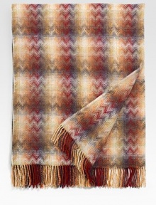 A sophisticated addition for any room, crafted with an intricate weave and warm, beautiful colors.Long fringe51x75Wool/polyamideDry cleanImported A sophisticated addition for any room, crafted with an intricate weave and warm, beautiful colors.Long fringe51x75Wool/polyamideDry cleanImported