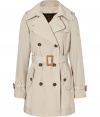 D&G Dolce & Gabbana modernizes the classic trench with a feminine silhouette and a bold leopard print lining - Large spread collar, epaulets, double-breasted, belted waist, flap pockets, belted cuffs, back storm flap and vent - Pair with a classic sheath and platform pumps or an elevated jeans-and-tee ensemble