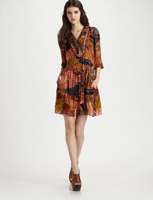 Finely-pleated silk finished with an abstract print for artful elegance.V-neck yoke Gathered three-quarter sleeves Contour empire waist About 20 from natural waist Silk; dry clean Imported Finely-pleated silk finished with an abstract print for artful elegance.V-neck yoke Gathered three-quarter sleeves Contour empire waist About 20 from natural waist Silk; dry clean Imported
