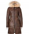 A chic alternative to the classic down coat, this supple leather and shearling take brings heightened style to your new season look - Fur-lined hood, stand collar, front zip closure, long sleeves with zip cuffs, patch pockets, patchwork paneling - Fitted silhouette - Style with skinny jeans, an oversized cashmere sweater, and over-the-knee boots