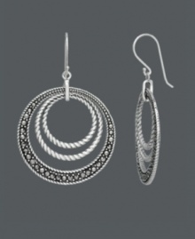 For a look that's out of this orbit -- just add Genevieve & Grace! Chic, circular rings shine with the addition of marcasite accents and an intricate rope edging. Crafted in sterling silver. Approximate drop: 1-3/4 inches. For a look that's out of this orbit -- just add Genevieve & Grace! Chic, circular rings shine with the addition of marcasite accents and an intricate rope edging. Crafted in sterling silver. Approximate drop: 1-3/4 inches.