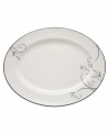 A fluid contemporary pattern with subtle shimmer dances along the edging of this platter. As a stylish accent for entertaining or a simple way to spruce up an everyday meal, the Voila collection always looks right. Qualifies for Rebate