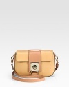 A demure flap-front style crafted of smooth vaccheta leather, with a removable shoulder strap for versatility. Adjustable, removable shoulder strap, 22-24 dropLock closure on front flapOne inside zip pocketFully lined8W X 5½H X 2DMade in Italy