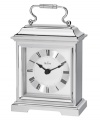 This formal carriage clock by Bulova adds elegance to an end table or side board. Rectangular spun and brushed aluminum case features a curved handle at top. Silver tone dial displays black Roman numerals and two hands.