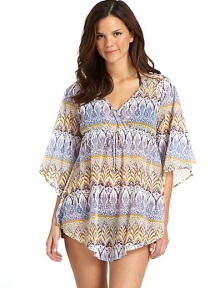 THE LOOKAllover floral paisley patternSurplice V-neckBell sleevesEmpire waist with drawstring closureCurved hemTHE FITAbout 28 from shoulder to hemTHE MATERIAL80% nylon/20% spandexCARE & ORIGINHand washMade in USA THE LOOKAllover floral paisley patternSurplice V-neckBell sleevesEmpire waist with drawstring closureCurved hemTHE FITAbout 28 from shoulder to hemTHE MATERIAL80% nylon/20% spandexCARE & ORIGINHand washMade in USA