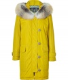 Luxurious parka in fine synthetic fiber - Eye-catching in gold olive and fox fur trimmed hood - Narrow with a thigh length hem, zipper, off-centered placket and patch pockets -  Fashionable and functional hit suitable for all outfits of the season