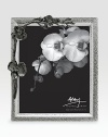 Inspired by the intricacies of natural forms, this graceful frame is richly detailed in cast metal with blackened floral accents. From the Black Orchid CollectionAccommodates a 8 X 10 photoOverall: 10 X 11¾Nickel-plate and blackened nickel-plateImported