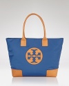 Make Tory Burch's signature coated canvas tote your day-to-day choice. Wear the color-dipped style to trim daytime denim and basics with the label's uptown polish.