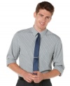 Add a pop of plaid to your work week wardrobe with this handsome slim fit shirt by Perry Ellis.