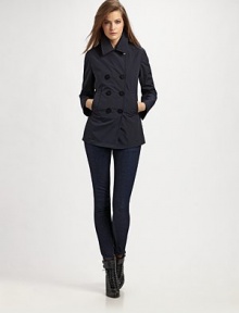 Classic double-breasted styling in crisp, lightweight canvas.Foldover collar Button front Welt pockets Back yoke Inverted back pleat Polyester; dry clean Imported Classic double-breasted styling in crisp, lightweight canvas.Foldover collar Button front Welt pockets Back yoke Inverted back pleat Polyester; dry clean Imported