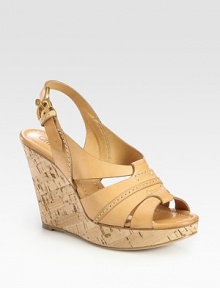 Natural cork wedge with rich leather straps and an adjustable slingback. Cork wedge, 4 (100mm)Cork platform, 1 (25mm)Compares to a 3 heel (75mm)Leather upperLeather lining and solePadded insoleMade in ItalyOUR FIT MODEL RECOMMENDS ordering one half size up as this style runs small. 