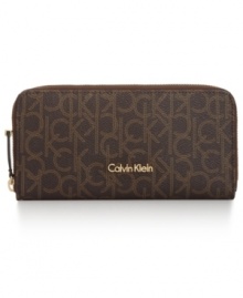 Organization with elegance. This luxe lovely from Calvin Klein will keep your credentials in signature style. Outfitted with the iconic CK monogram, it flaunts multiple pockets and compartments for effortless go-everywhere accessorizing. Organization with elegance. This luxe lovely from Calvin Klein will keep your credentials in signature style. Outfitted with the iconic CK monogram, it flaunts multiple pockets and compartments for effortless go-everywhere accessorizing.