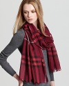 In a red-and-pink Burberry check, this oblong scarf offers lightweight luxe with its sheer, gauzy fabrication.