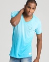 This fashionably faded tee sports True Religion's signature horseshoe print at the chest.