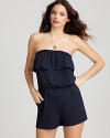 Pull on Shoshanna's ruffle neck romper for a backyard barbeque or day at beach.