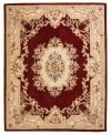 Modeled after 17th century Aubusson rugs, the Jade area rug offers a traditional floral motif in a contemporary burgundy and ivory colorway. Crafted of rich wool.