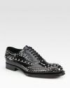 Studded lace-up design with exaggerated sole.Leather upperLeather liningWood/rubber soleMade in Italy