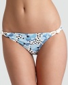 A super cute swim bottom with all the Juicy details: a fun floral pattern and side rope ties.