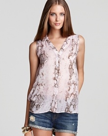 In a pastel snakeskin print, this Aqua blouse lends chic in a sleeveless silhouette, finished with a high-low hem. In a pastel snakeskin print, this Aqua blouse lends chic in a sleeveless silhouette, finished with a high-low hem.