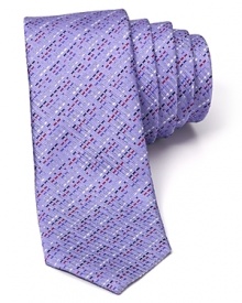 Indulge in the exceptionally soft, textured silk of this fine tie from HUGO, featuring a skinny silhouette for modern appeal and an alluring stripe pattern. Indulge in the exceptionally soft, textured silk of this fine tie from HUGO, featuring a skinny silhouette for modern appeal and an alluring stripe pattern.