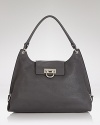 Salvatore Ferragamo gives its sought after hobo a polished update. In pebbled leather with silver tone detailing, this carryall will punctuate every pulled together look.