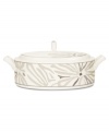 Abstract markings in soft shades of khaki fill in this glazed white covered vegetable bowl for unconventional elegance. Matte platinum bands and arched, geometric handles look sharp on casual and formal tables alike. From Noritake's collection of serveware and serving dishes.